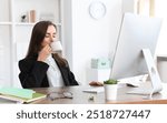 Businesswoman drinking coffee at table in office. Break time