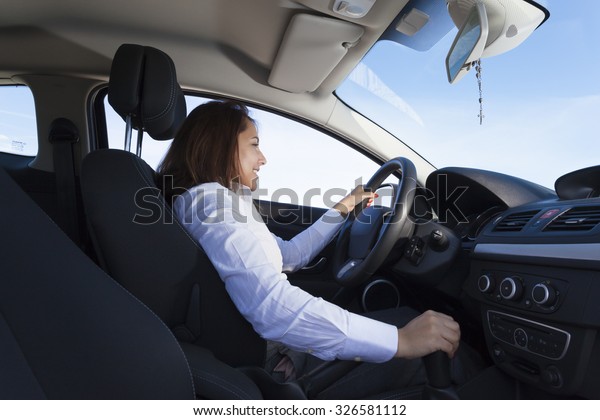 Businesswoman driving a sports\
car