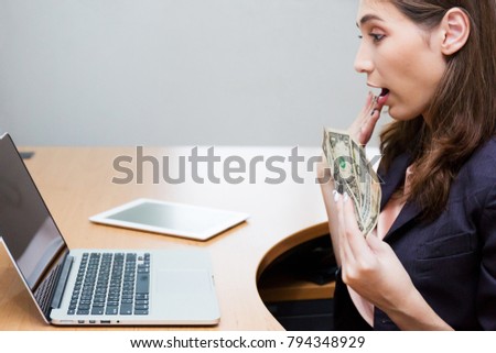 Businesswoman excited when shares is up.