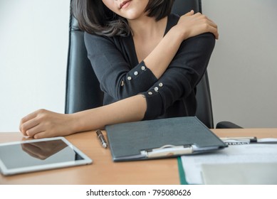 Businesswoman Feeling Pain In Neck Shoulder After Sitting At Desk. Tired Woman Suffering Of Office Syndrome After Long Hours Work On Computer.