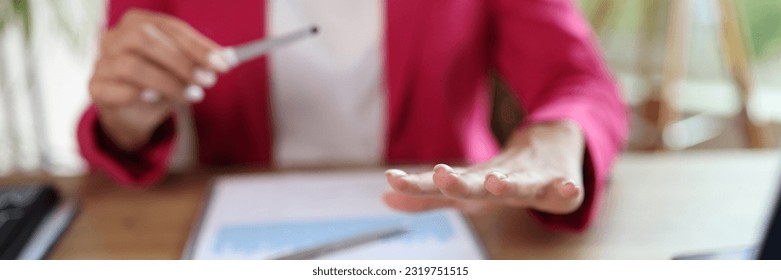 Businesswoman in formal wear filing nails at workplace in office. Strict business manicure - Powered by Shutterstock