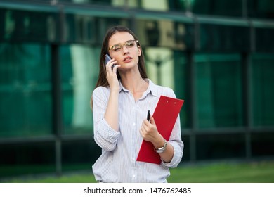 Young Office Worker Talking On Phone Stock Photo (Edit Now) 1519711346