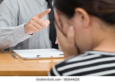 Businesswoman getting intimidated after scolded by boss - Shutterstock ID 583644028