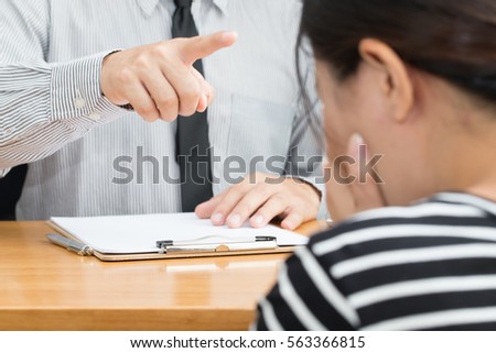 Businesswoman getting intimidated after scolded by boss