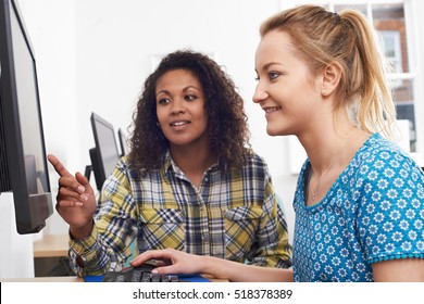 Businesswoman Giving Computer Training In Office