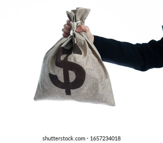 Businesswoman hand holding a money bag with dollar sign. - Powered by Shutterstock