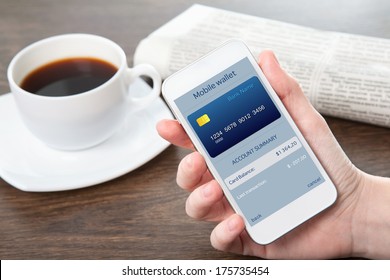 Businesswoman Hand Holding A Phone With Mobile Wallet Onlain Shopping On The Screen In The Office