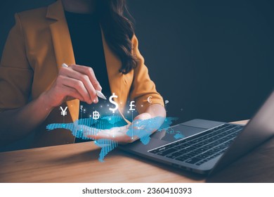 Businesswoman hand holding virtual world with international currency include dollar yuan yen euro and pound sterling sign. Concept of global currency exchange, money transfer and forex by technology. - Powered by Shutterstock