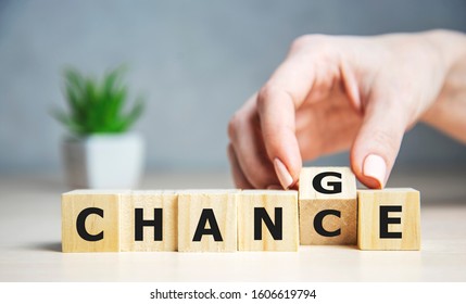 Businesswoman hand holding wooden cube with flip over block CHANGE to CHANCE word on table background. success, strategy, solution, business and Positive thinking concepts - Powered by Shutterstock