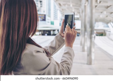 Businesswoman hand using stylus pen  on device or smartphone - Powered by Shutterstock