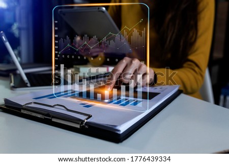businesswoman hand working with digital tablet at modern office, Digital marketing media and business strategy concept, Blurred background.
