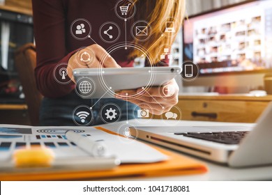  businesswoman hand working with laptop computer, tablet and smart phone in modern office with virtual icon diagram at modernoffice in morning light  - Shutterstock ID 1041718081