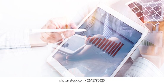 businesswoman hand working with laptop computer, tablet and smart phone in modern office with virtual icon diagram at modernoffice in morning light - Shutterstock ID 2141793625