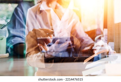 businesswoman hand working with laptop computer, tablet and smart phone in modern office with virtual icon diagram at modernoffice in morning light - Shutterstock ID 2214476515