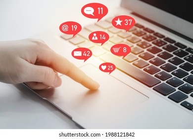 businesswoman hand working on digital laptop computer with social network icon on desk at home office, digital marketing, feedback, social network, business finance, media and technology concept