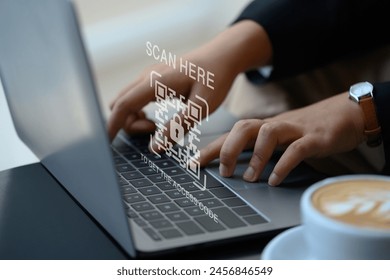 Businesswoman hands typing on laptop with verification QR code login. Cybersecurity concept - Powered by Shutterstock