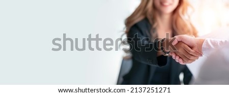 Businesswoman handshake and business people. Successful business concept. Banner background, panoramic view.