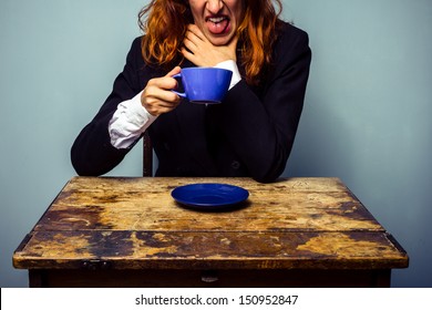 Businesswoman has had a very bad cup of coffee