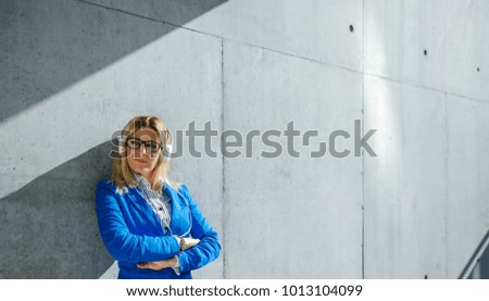 Similar – Young woman stiring coffee looking back