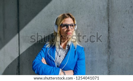 Similar – Young woman stiring coffee looking back