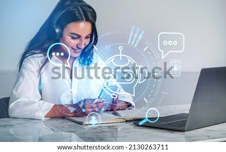 Businesswoman in headphones smiling, using smartphone, hologram of voice chat. Bot icon and social network signs, double exposure. Office table with laptop. Concept of communication
