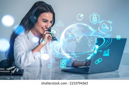 Businesswoman in headphones working with laptop, earth digital hologram with icons. Global online connection. Concept of metaverse