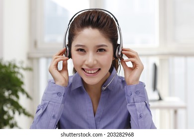 	Businesswoman with headset	 - Shutterstock ID 203282968