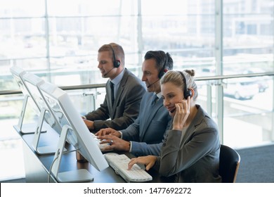 Businesswoman with her colleagues working on computer at desk in office. Modern corporate start up new business concept with entrepreneur working hard - Shutterstock ID 1477692272