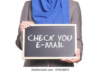 Businesswoman holding a chalk board written Check Your E-Mails - Shutterstock ID 374518873