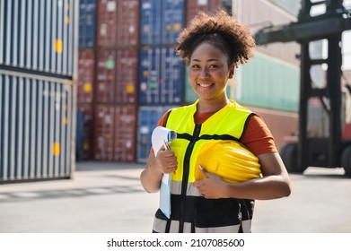 Businesswoman holding clipboard with container background - Powered by Shutterstock