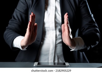 Businesswoman Holding Important Message Between Hands. Woman In Suit Showing New Crutial Idea Among Palms. Executive Presenting Updated Critical Information. - Shutterstock ID 2182905229
