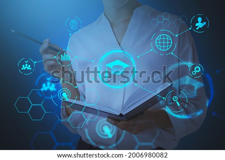 Businesswoman holding an open book and is going to take some notes, pondering about educational prospective in future career, master degree programs in business administration, postgraduate level