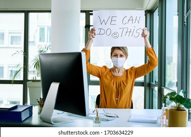 Businesswoman Holding Placard With We Can Do This Text As Support During Virus Epidemic. 