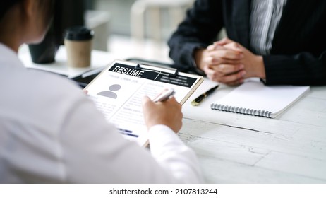 Businesswoman Holding Resume And Talking To Female Applicants By Making Appointments For Resumes And Job Interviews.