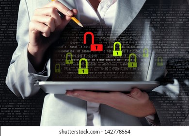 Businesswoman holding tablet pc entering password. Security concept