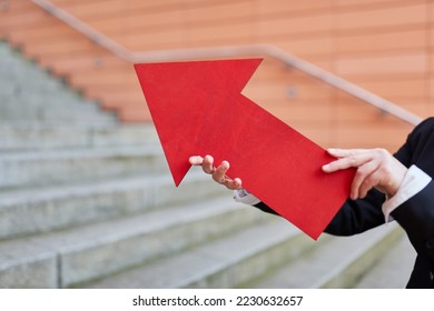 Businesswoman holding ted arrow sign as growth and innovation concept symbol - Shutterstock ID 2230632657