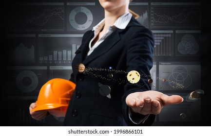 Businesswoman Holds In Palm Solar System 3d Model. Woman In Business Suit With Orange Safety Helmet. Space Company Project Presentation. Innovation And Entrepreneurship. Engineering And Management.