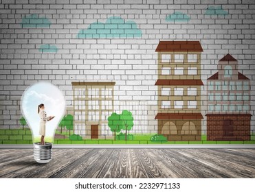 Businesswoman inside light bulb against city drawn concept - Shutterstock ID 2232971133