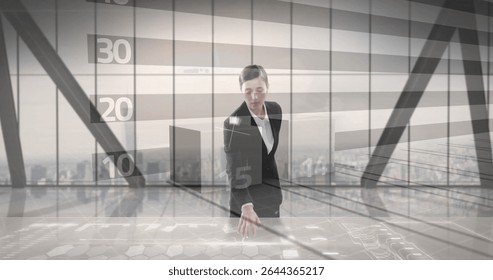 Businesswoman interacting with holographic table in high-rise office, with digital graphs. Technology, innovation, futurism, corporate, data, analytics, modern