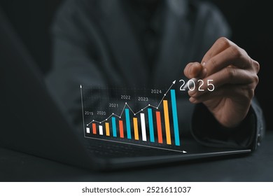 Businesswoman investor analyzes profitability of working companies with digital augmented reality graphics, positive indicators in 2025, businessman calculates financial data for long-term investments - Powered by Shutterstock