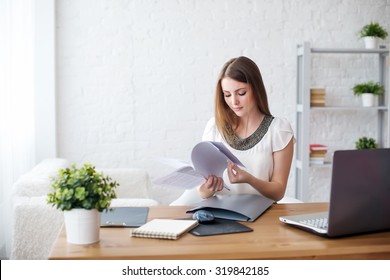 businesswoman with laptop and diary concept freelance work at home, planning, scheduling.