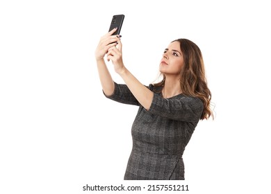 Businesswoman Looking For Signal, In A Place Of Bad Cell Reception, Isolated On White