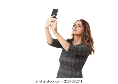 Businesswoman Looking For Signal, In A Place Of Bad Cell Reception, Isolated On White