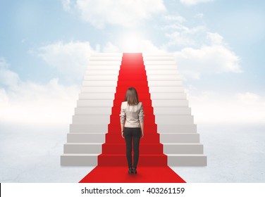 Businesswoman looking at stairs to heaven