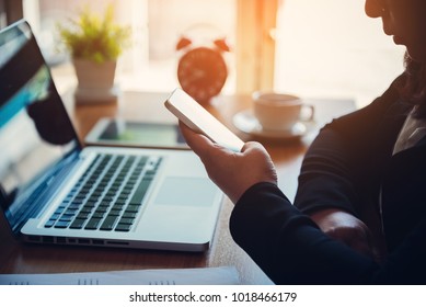 Businesswoman Making A Call Using A Smart Phone