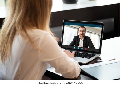 Businesswoman making video call to business partner using laptop, looking at screen with virtual web chat, contacting client by conference, talking on webcam, online consultation, hr concept, close up - Shutterstock ID 699442555