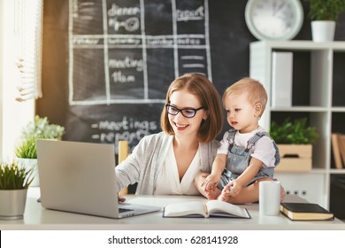 Businesswoman mother  woman with a toddler working at the computer
 - Powered by Shutterstock