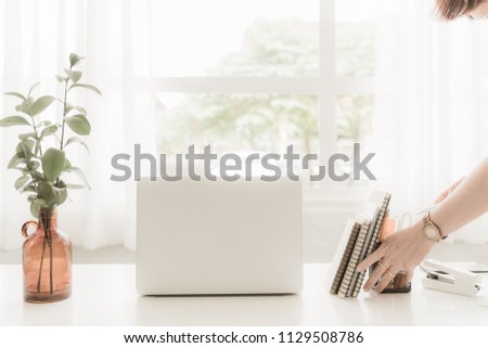 Businesswoman with office desk table, laptopcomputer, supplies with copy space