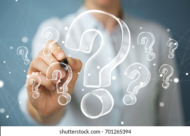 Businesswoman on blurred background drawing hand drawn question marks