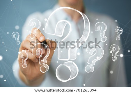 Businesswoman on blurred background drawing hand drawn question marks